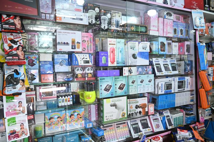 Earphones, chargers and mobile accessories on the shop wall