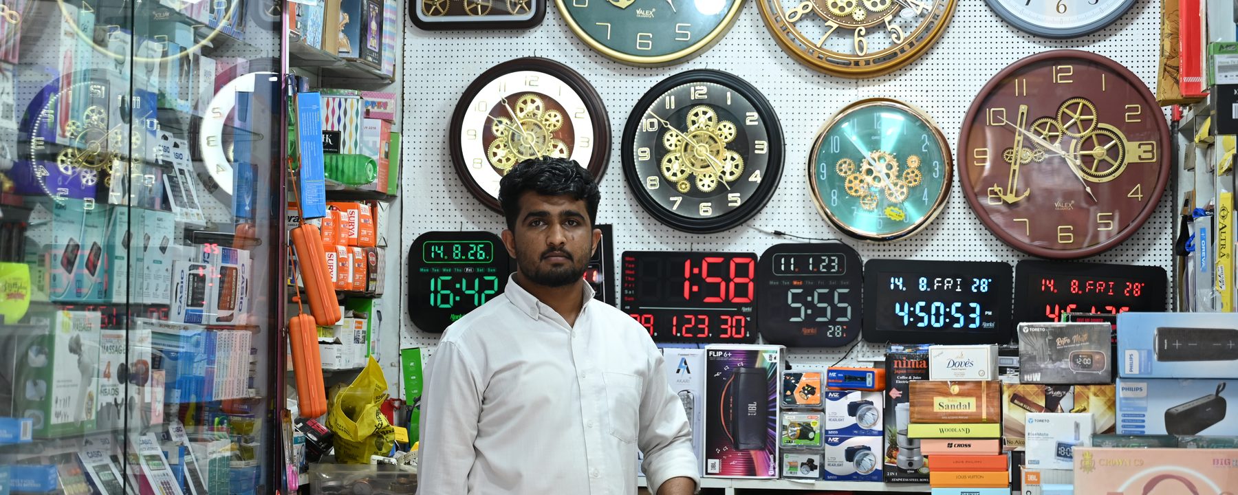 The main counter and clock wall inside Munna Electronics