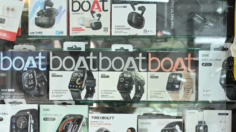 boAt earbuds and smart watches on the accessories shelf